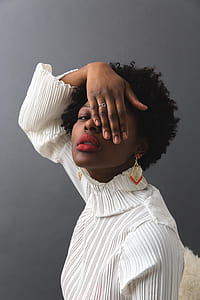 woman holding her right eye thumbnail