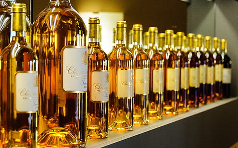 selective focus photography of displayed liquor bottles thumbnail