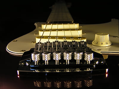 white and brown stratocaster electric guitar thumbnail