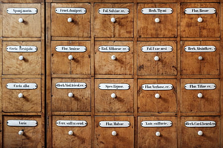 photography of brown wooden filing cabinet drawers thumbnail