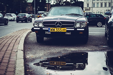 black Mercedes-Benz car parked on road beside road thumbnail