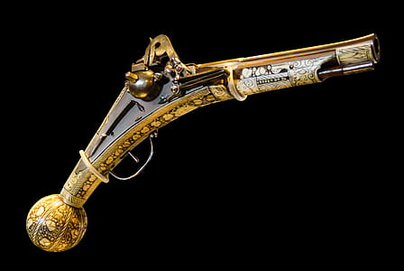vintage brass-colored pistol thumbnail