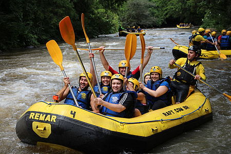 men and women riding on raft thumbnail