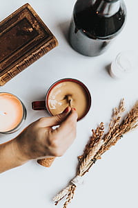 person stirring a cup of coffee thumbnail