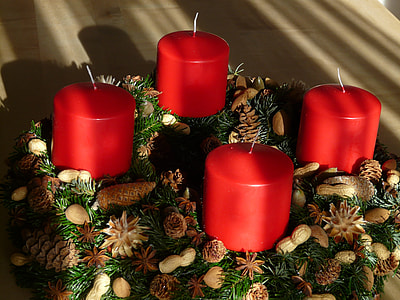close-up photography of four red pillar candles thumbnail