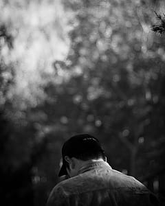 man wearing cap in grayscale photo thumbnail