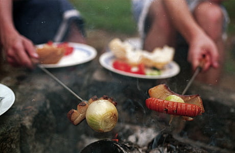 selective focus photo of persons holding barbecues during daytime thumbnail