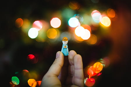 Person Holding Woman Wearing Dress Plastic Toy thumbnail