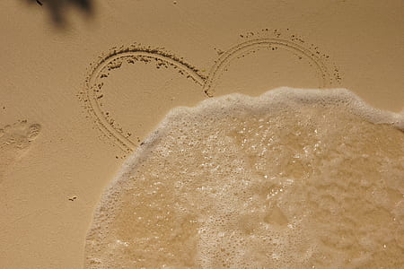heart sand art under sunny sky thumbnail