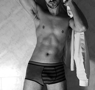 man wearing gray boxers black and white photo thumbnail