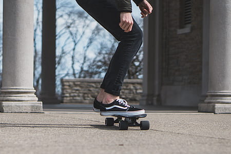 person wearing black VANS Old Skool shoes riding skateboard thumbnail
