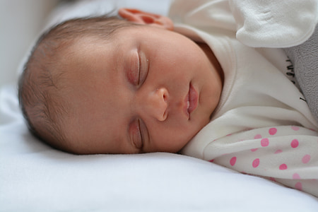 baby sleeping on bed thumbnail