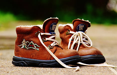 shallow focus photo of pair of brown boots thumbnail