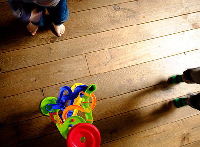green and blue plastic garage toy on floor thumbnail