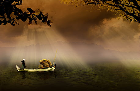 Man in a White Boat in Sea during Daytime thumbnail