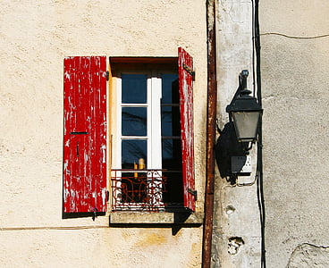 black lamp sconce beside opened window thumbnail