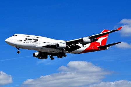 white and red Qantas airplane above skies thumbnail