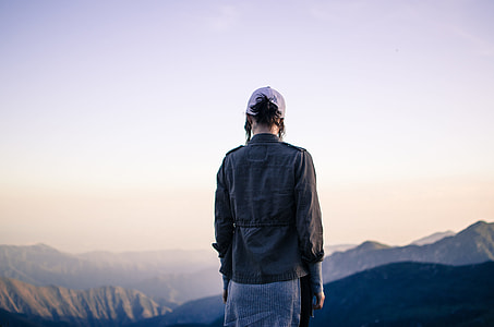 women in gray jacket near cliff thumbnail