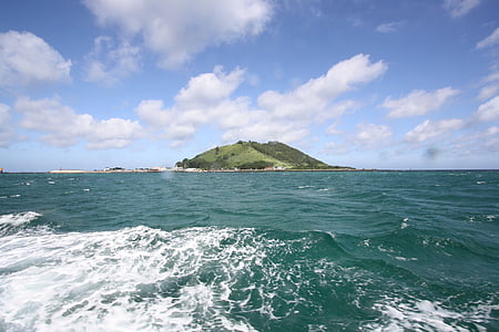 island in the middle of body of water thumbnail