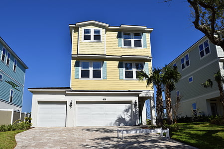 yellow and white 3-storey house thumbnail