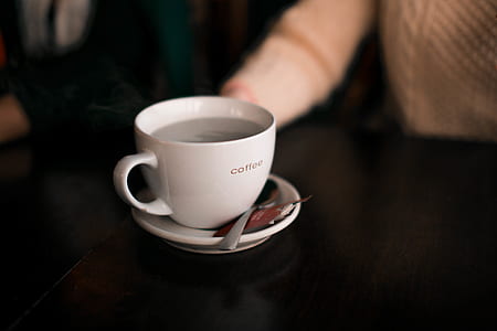 teacup and saucer on table thumbnail