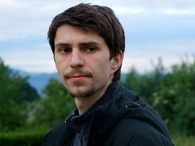 man wearing zip-up jacket at daytime thumbnail