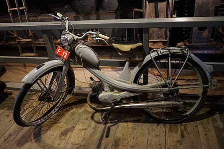 motorized bicycle on brown flooring thumbnail