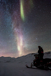 man beside snowmobile thumbnail