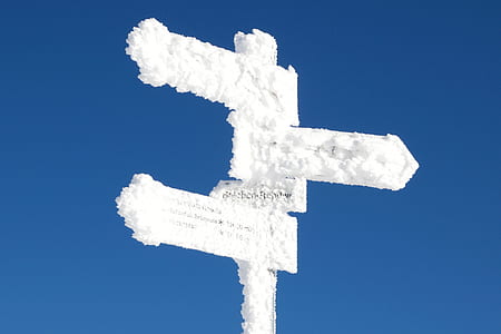 road signage covered with snow thumbnail