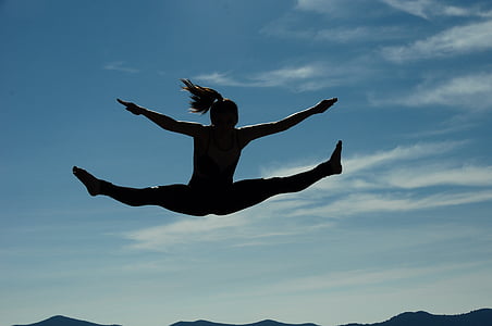 silhouette photography of woman jumping at daytime thumbnail