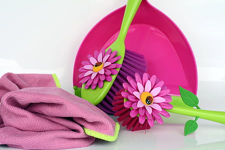 two pink and green hair brushes near pink textile thumbnail