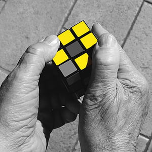 selective color of person holding Rubik's Cube thumbnail