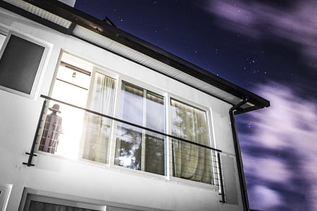 white and black house under starry sky thumbnail