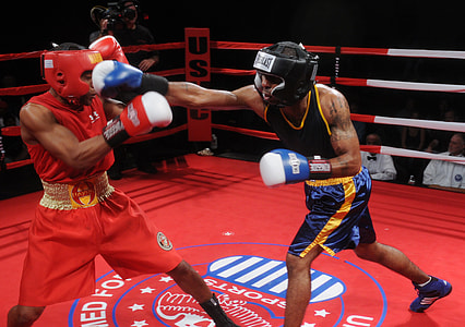 two men playing boxing on top red arena thumbnail