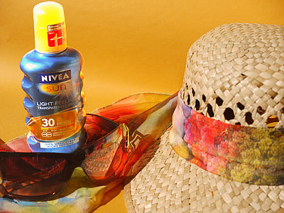 Nivea Sun sunblock beside brown hat thumbnail