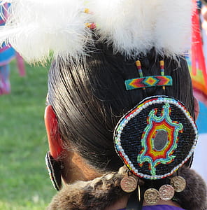 woman with teal and red headdress thumbnail