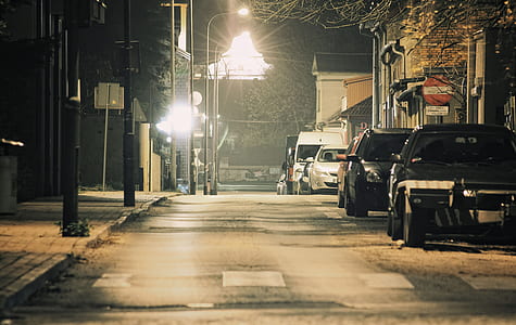parked vehicles beside houses thumbnail