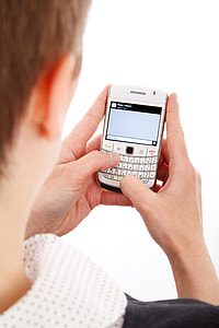 man holding white qwerty phone thumbnail