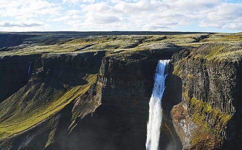 waterfalls between mountain cliff thumbnail