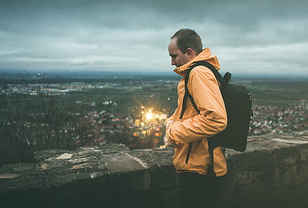 man with hands in jacket pocket thumbnail