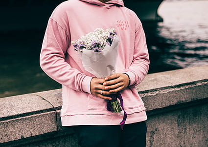 person holding bouquet of flowers thumbnail