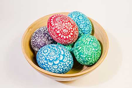six assorted-color egg decors on brown ceramic bowl thumbnail