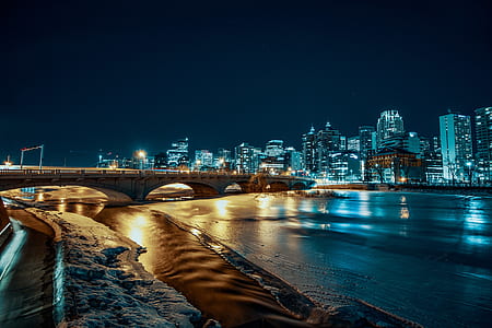 landscaped photo of a high-rise buildings and body of water thumbnail