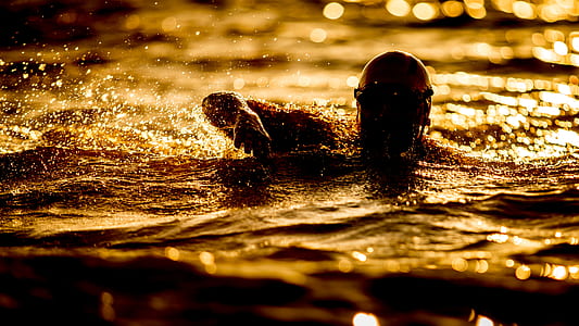 close-up photography of person on body of water thumbnail