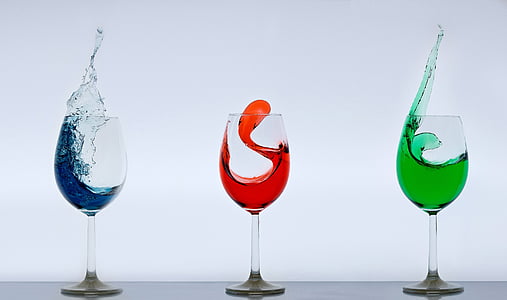 three clear wine glasses with substance thumbnail