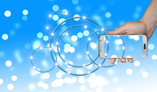 person holding white Android smartphone thumbnail