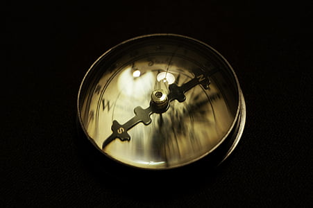 macro photography of brown navigational compass thumbnail