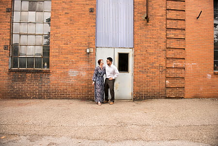 Man And Woman Standing Near Door thumbnail