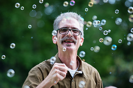 man looking on bubbles on sky thumbnail