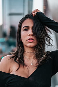 woman holding her hair thumbnail